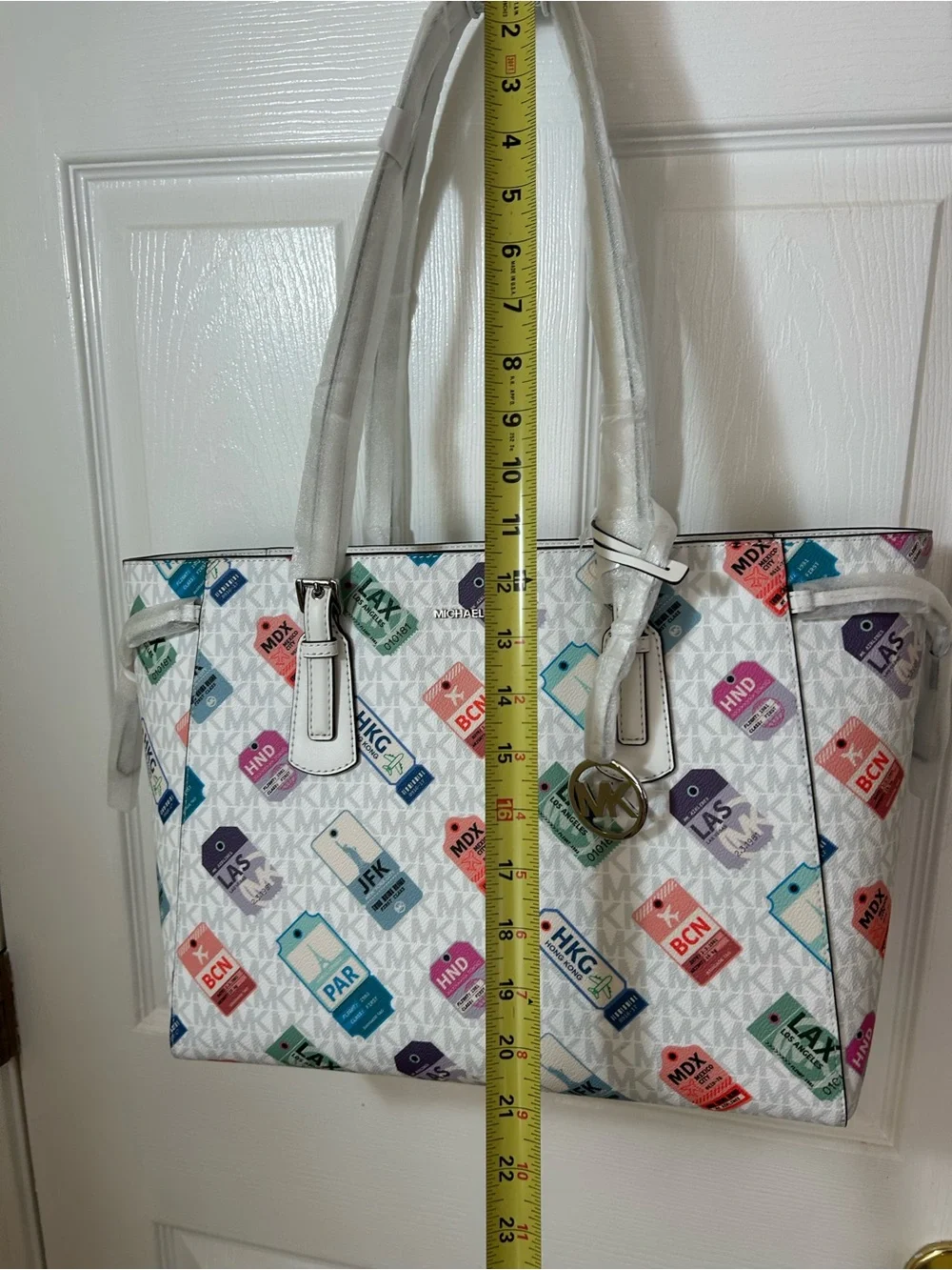 Michael Kors White Tote with Multicolor Luggage Tag Pattern